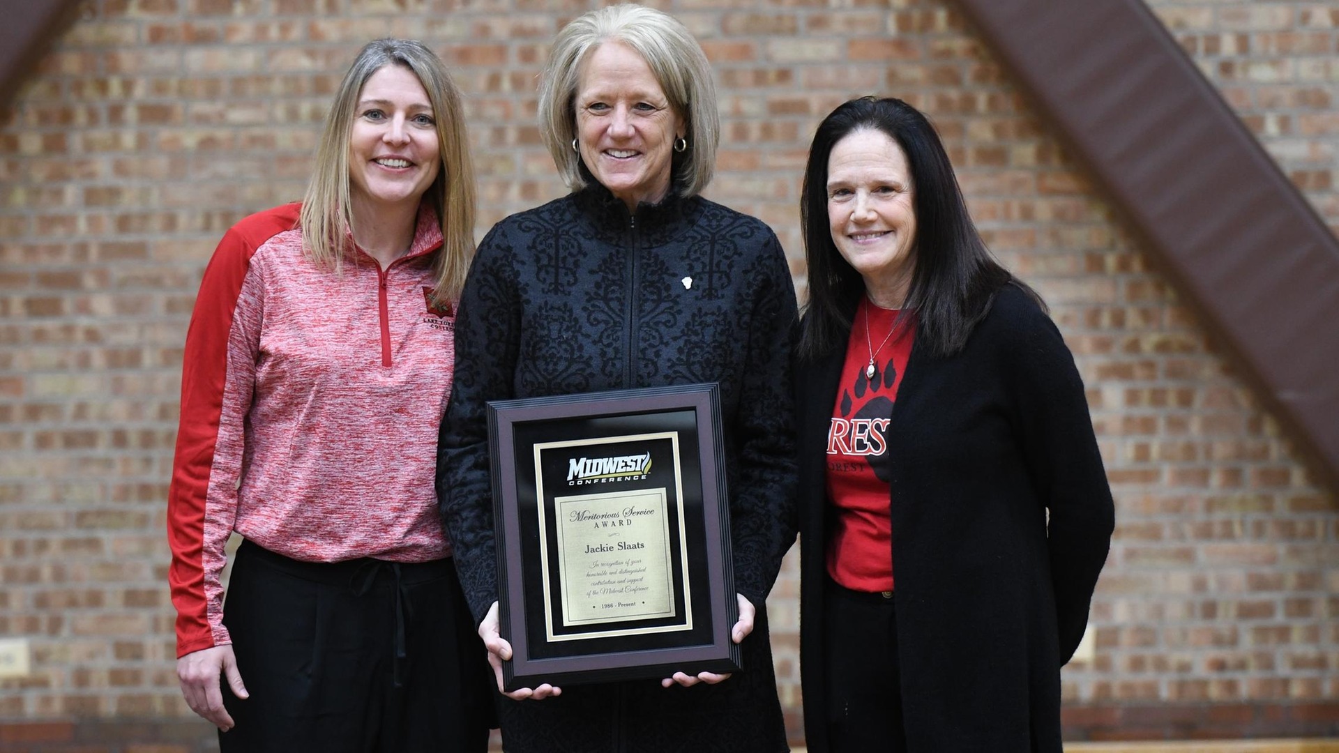 Jackie Slaats with Lake Forest College Director of Athletics Nicki Pieart (left) and President Jill Baren (right)